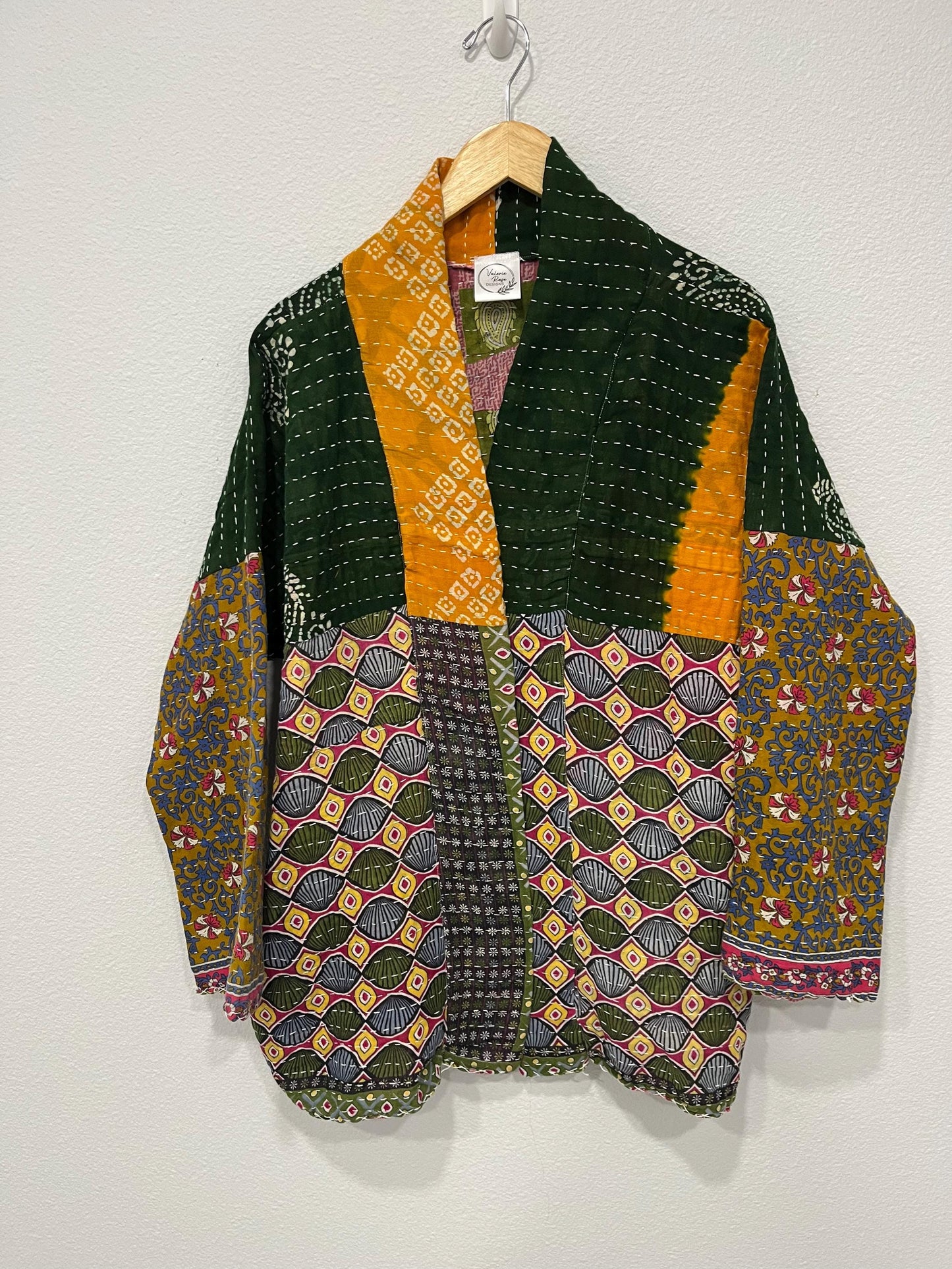 Luxury Boho Green and yellow geometric pattern and Patchwork-like quilted Jacket is made from Kantha Cloth. It is Reversible for 2 looks in one, Sustainably made and great for traveling.