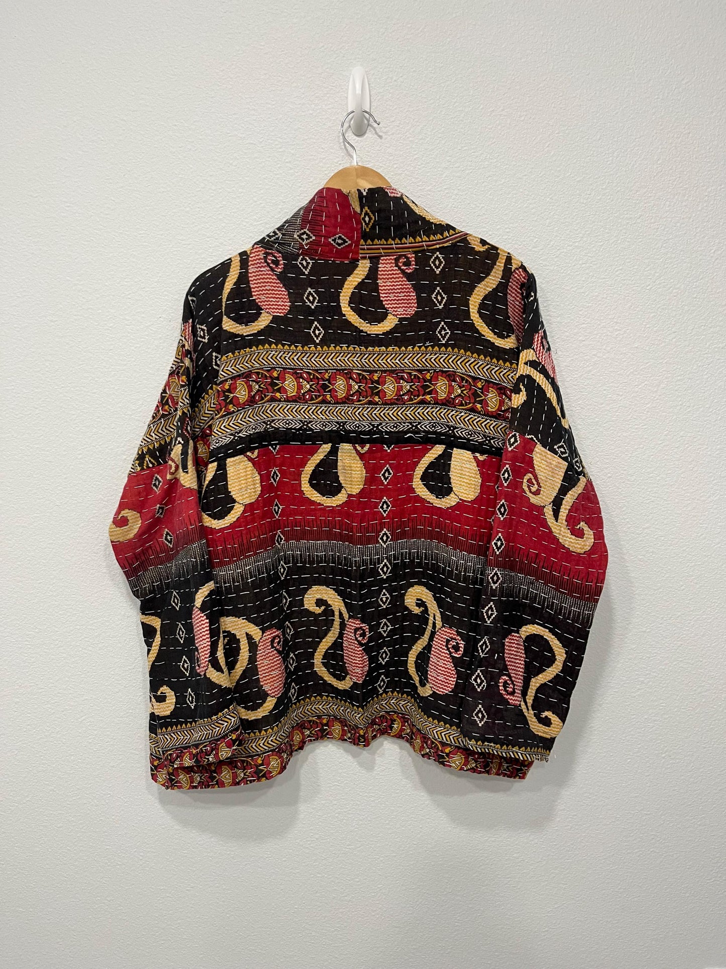 This soft and comfortable, Red, Black and Beige Quilted jacket is made from Kantha Cloth that has a story. It is wonderful for traveling. It is reversable for 2 looks in one and is light weight for easy packing