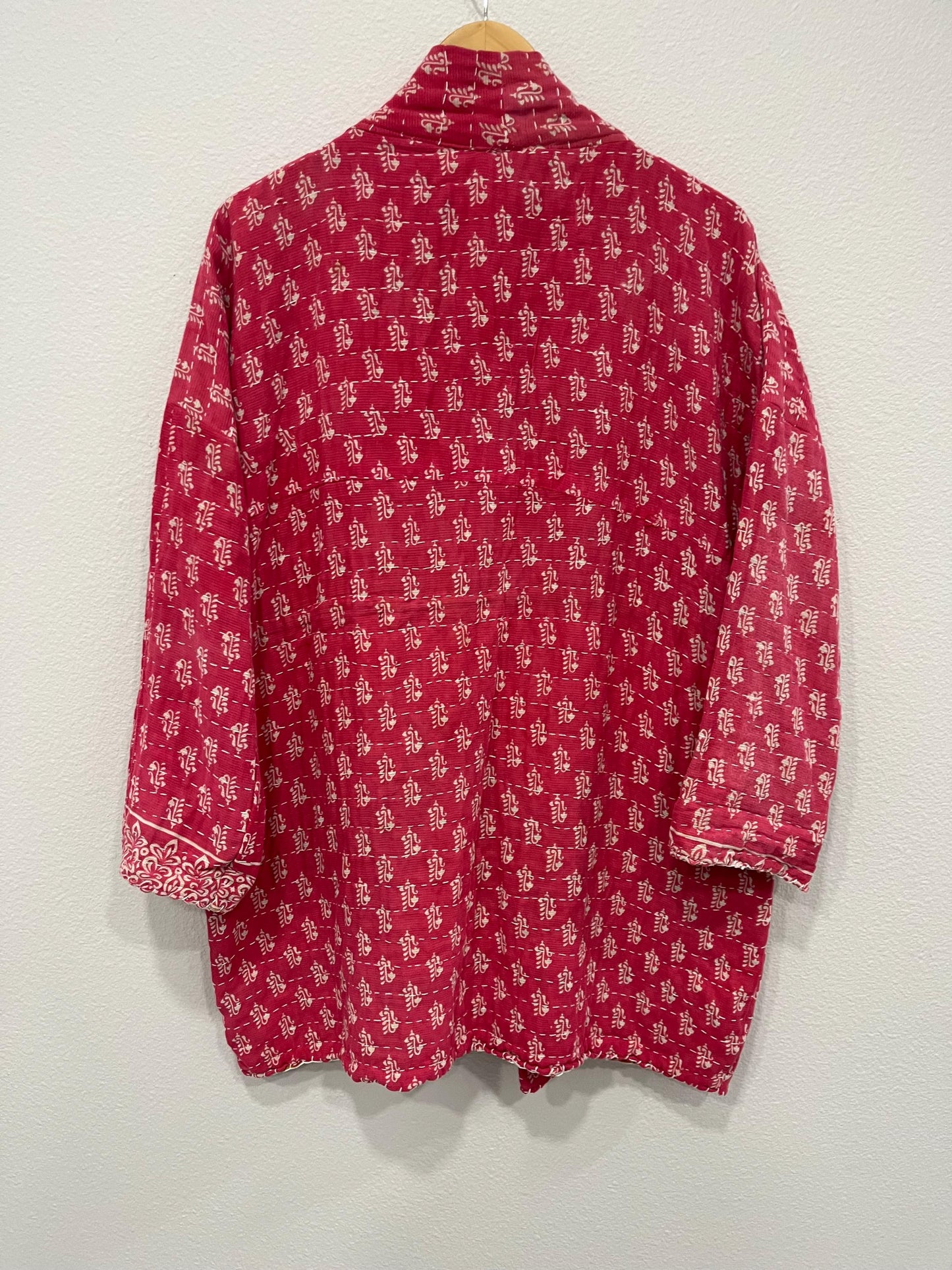 This Boho style, Pink and white patterned quilted jacket made from Kantha Cloth. This Jacket is great for traveling as it is reversable for 2 looks in 1 and light weight for easy packing.