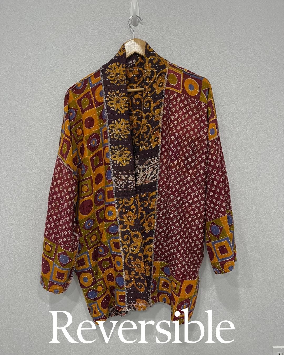 This is a unique, quilted dark burgundy and Dark gold quilted statement jacket with large pockets made for easy traveling in style.