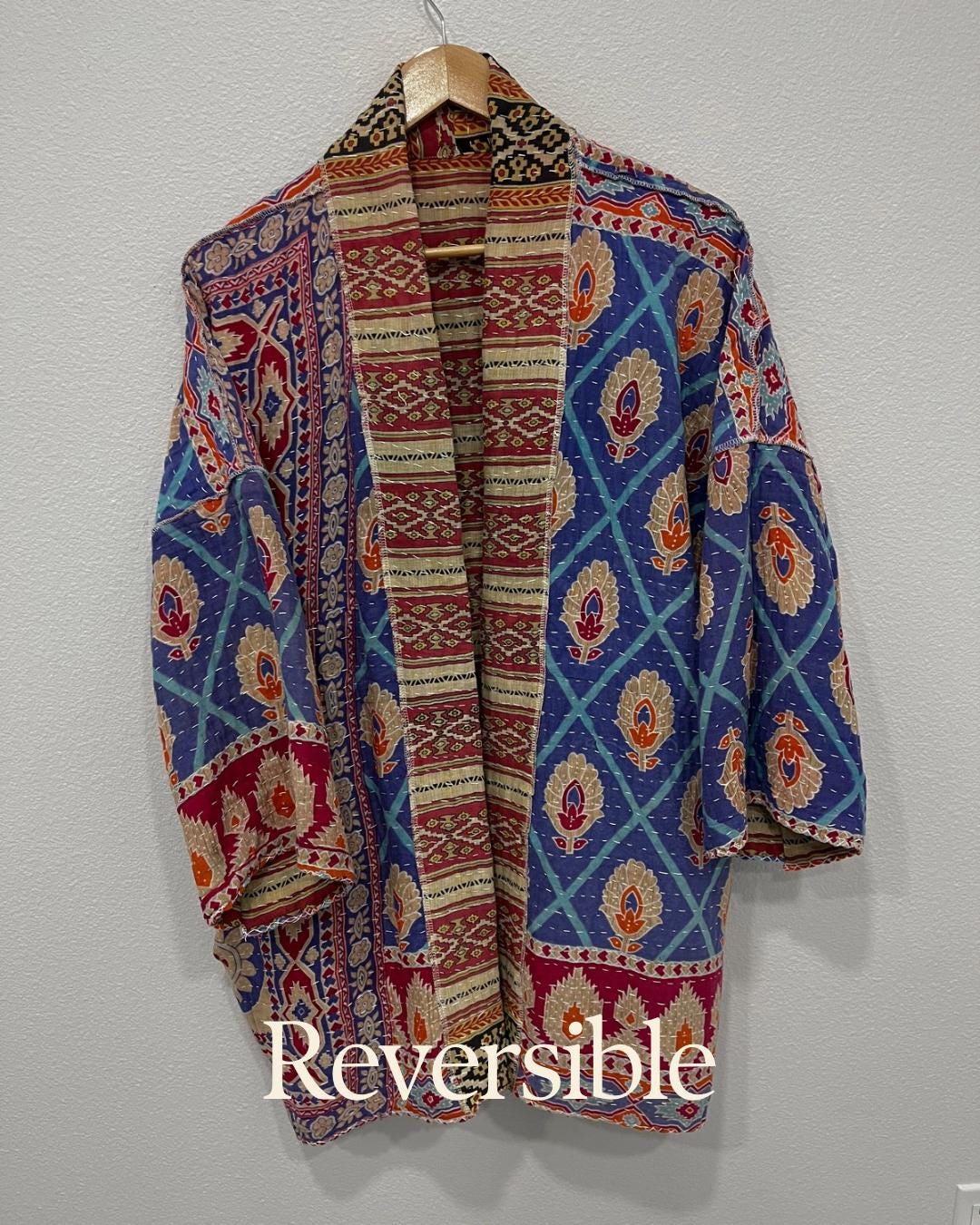 Luxury unique reversible quilted jacket in a Red, Beige and Black linear design. This Jacket is made for easy traveling with style.