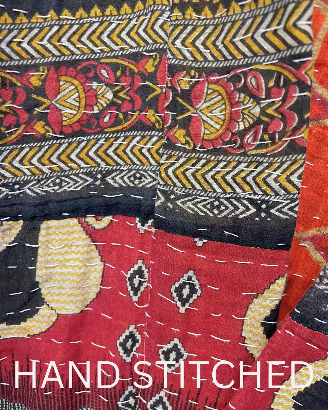 This soft and comfortable, Red, Black and Beige Quilted jacket is made from Kantha Cloth that has a story. It is wonderful for traveling. It is reversable for 2 looks in one and is light weight for easy packing