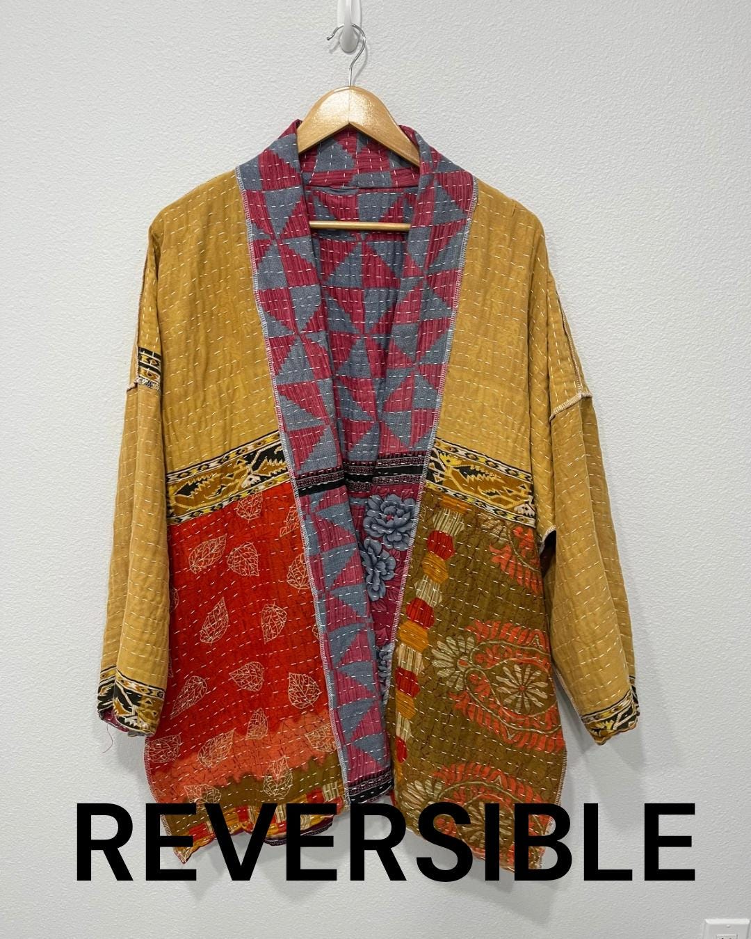Unique, reversible, quilted, statement jacket made for easy traveling in style. This Blue and Rose-colored piece with floral border. It is comfortable and so soft..