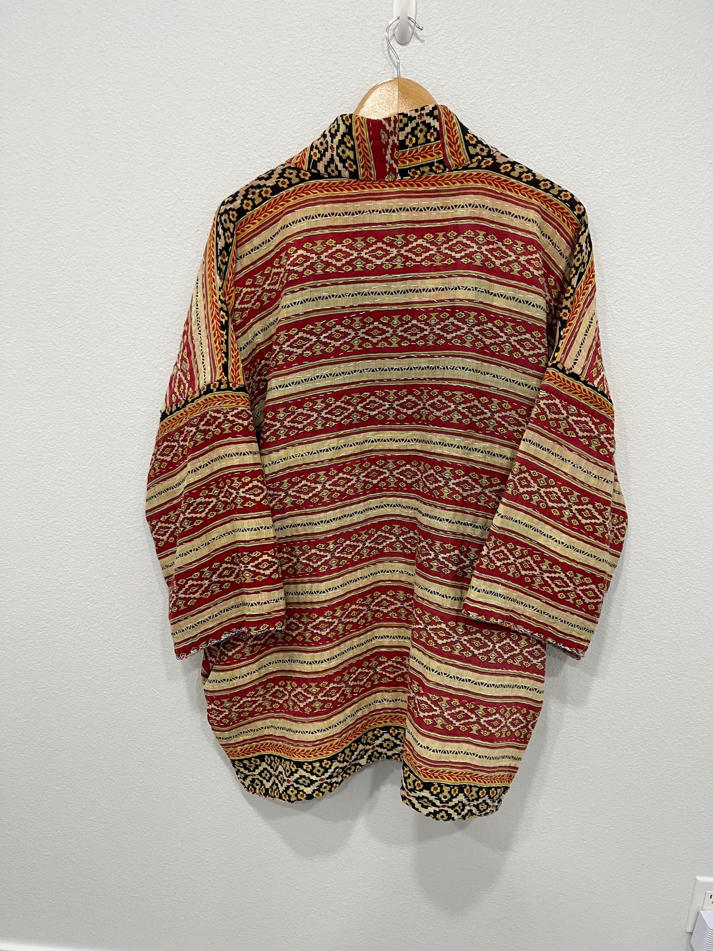 Luxury unique reversible quilted jacket in a Red, Beige and Black linear design. This Jacket is made for easy traveling with style.