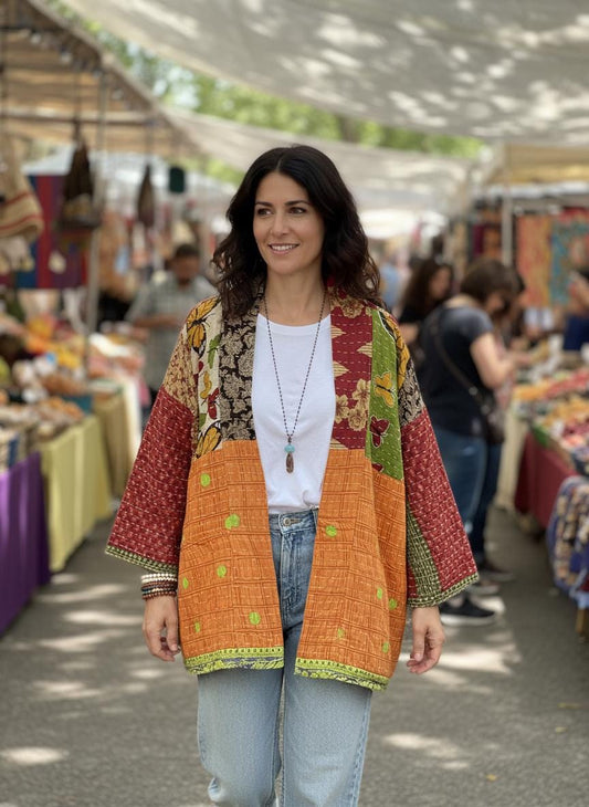 Luxury, unique, reversible, quilted jacket made for easy travel. This is multicolor with a patchwork effect made of Kantha Cloth.