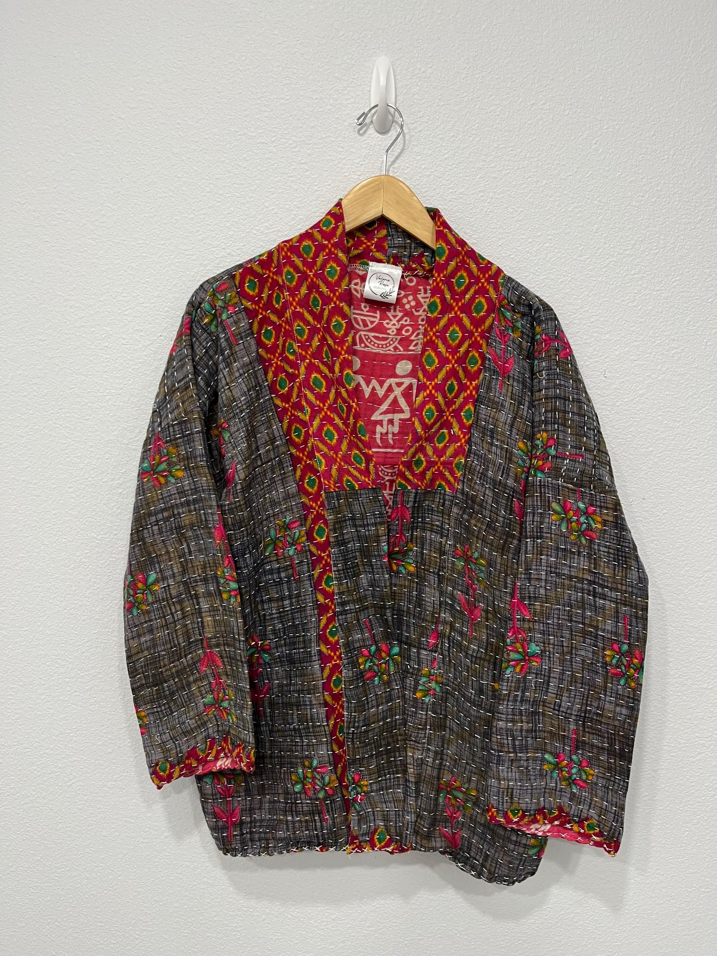 This Gray and Red patterned Boho Quilted Jacket is made with Kantha Cloth. It is reversible for 2 looks in one, sustainably made, and great for traveling.