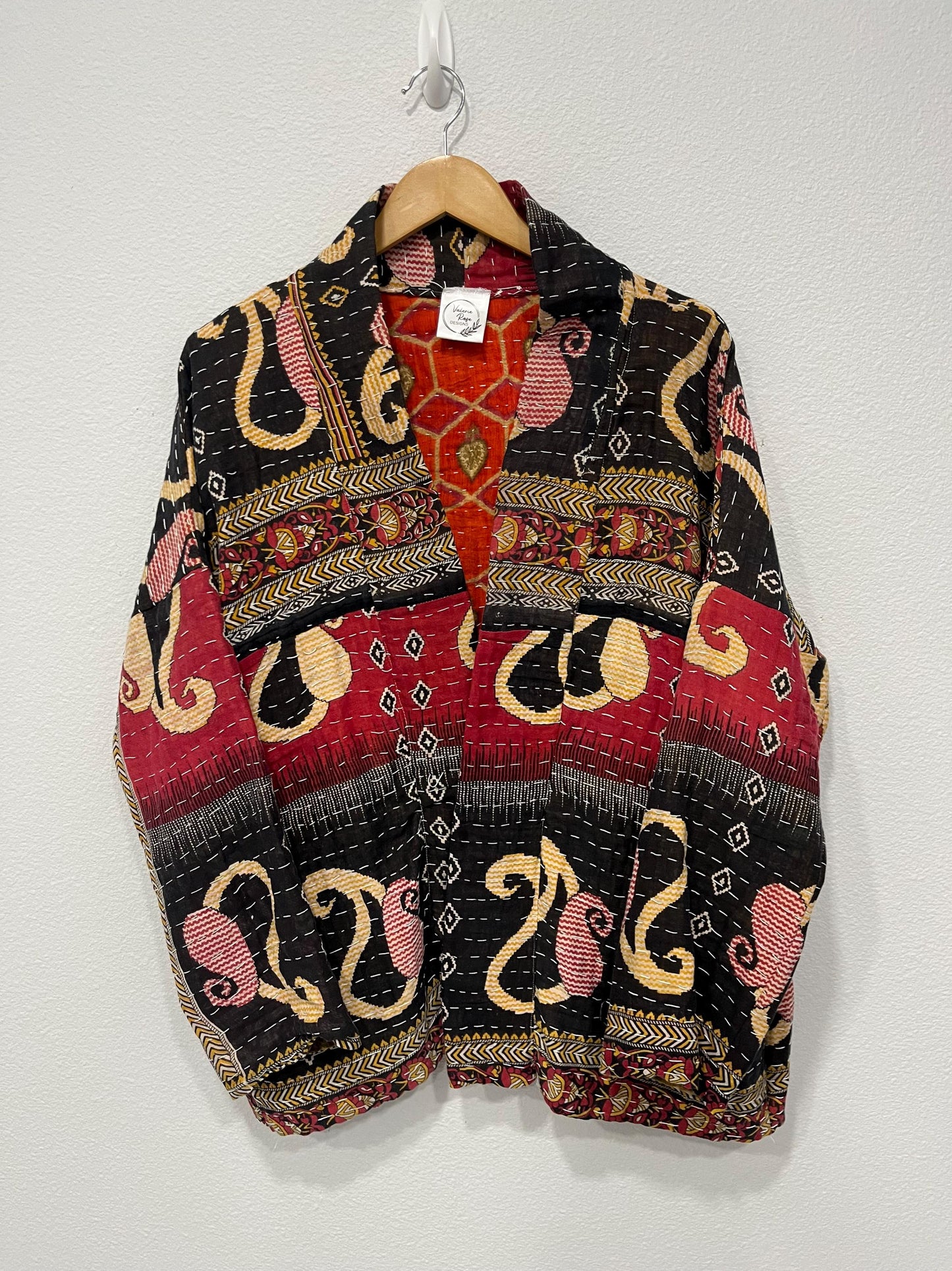 This soft and comfortable, Red, Black and Beige Quilted jacket is made from Kantha Cloth that has a story. It is wonderful for traveling. It is reversable for 2 looks in one and is light weight for easy packing
