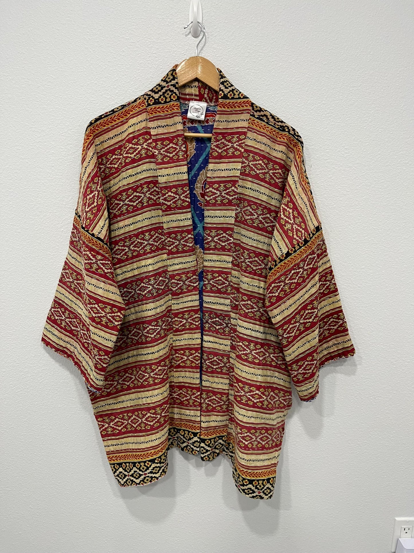 Luxury unique reversible quilted jacket in a Red, Beige and Black linear design. This Jacket is made for easy traveling with style.