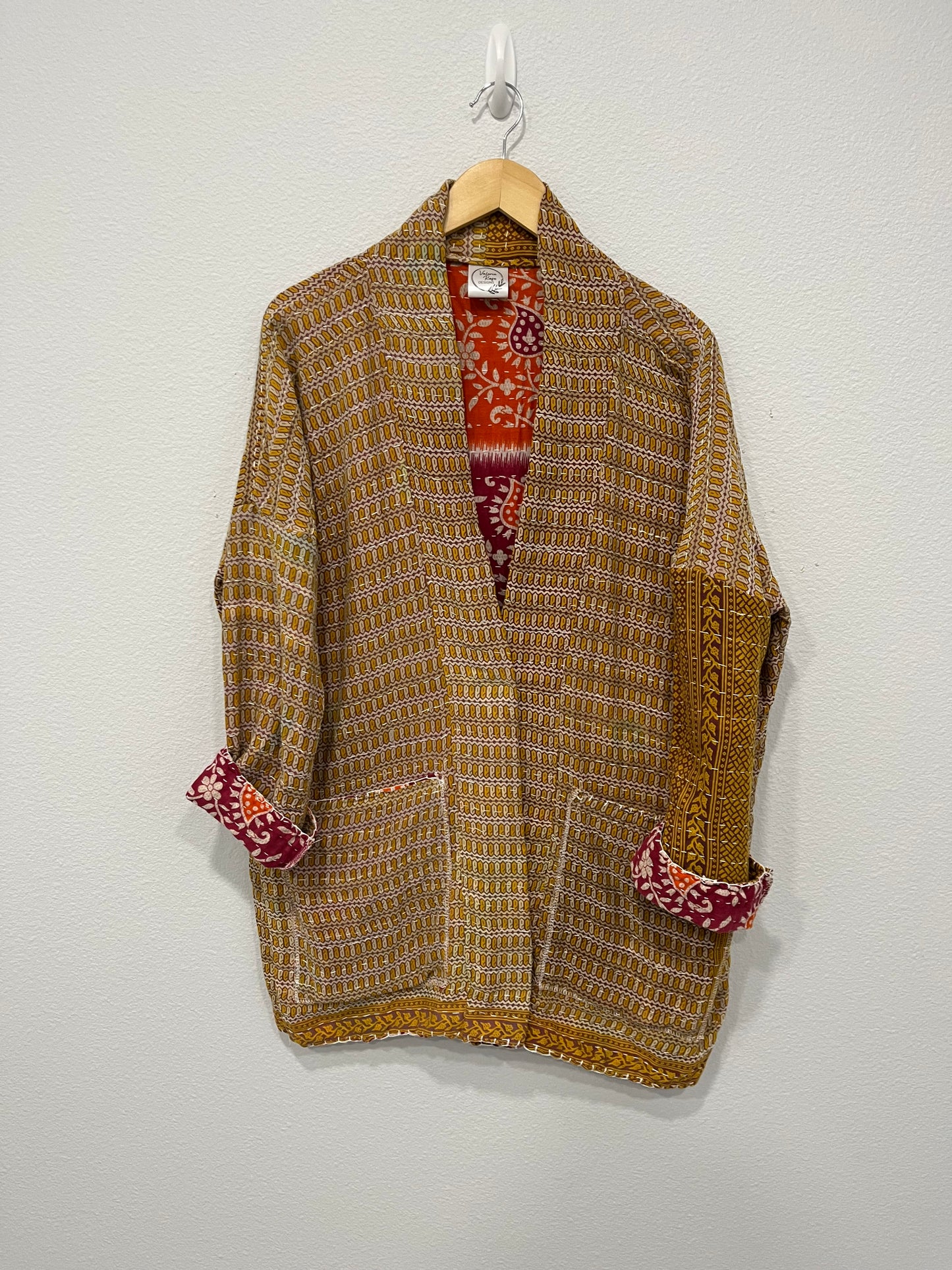 One-of-a-kind, reversible, quilted, Jacket. The modern patchwork makes this lightweight, stylish and comfy.