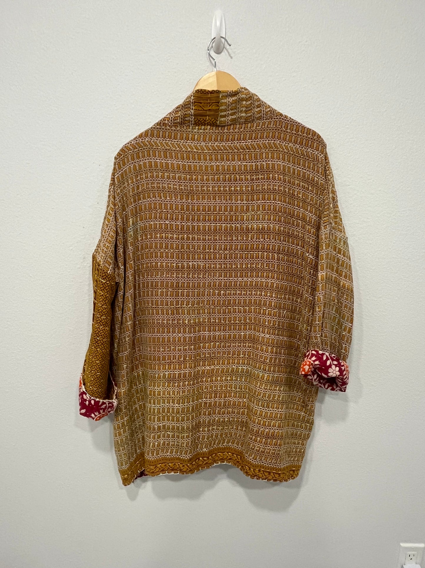One-of-a-kind, reversible, quilted, Jacket. The modern patchwork makes this lightweight, stylish and comfy.
