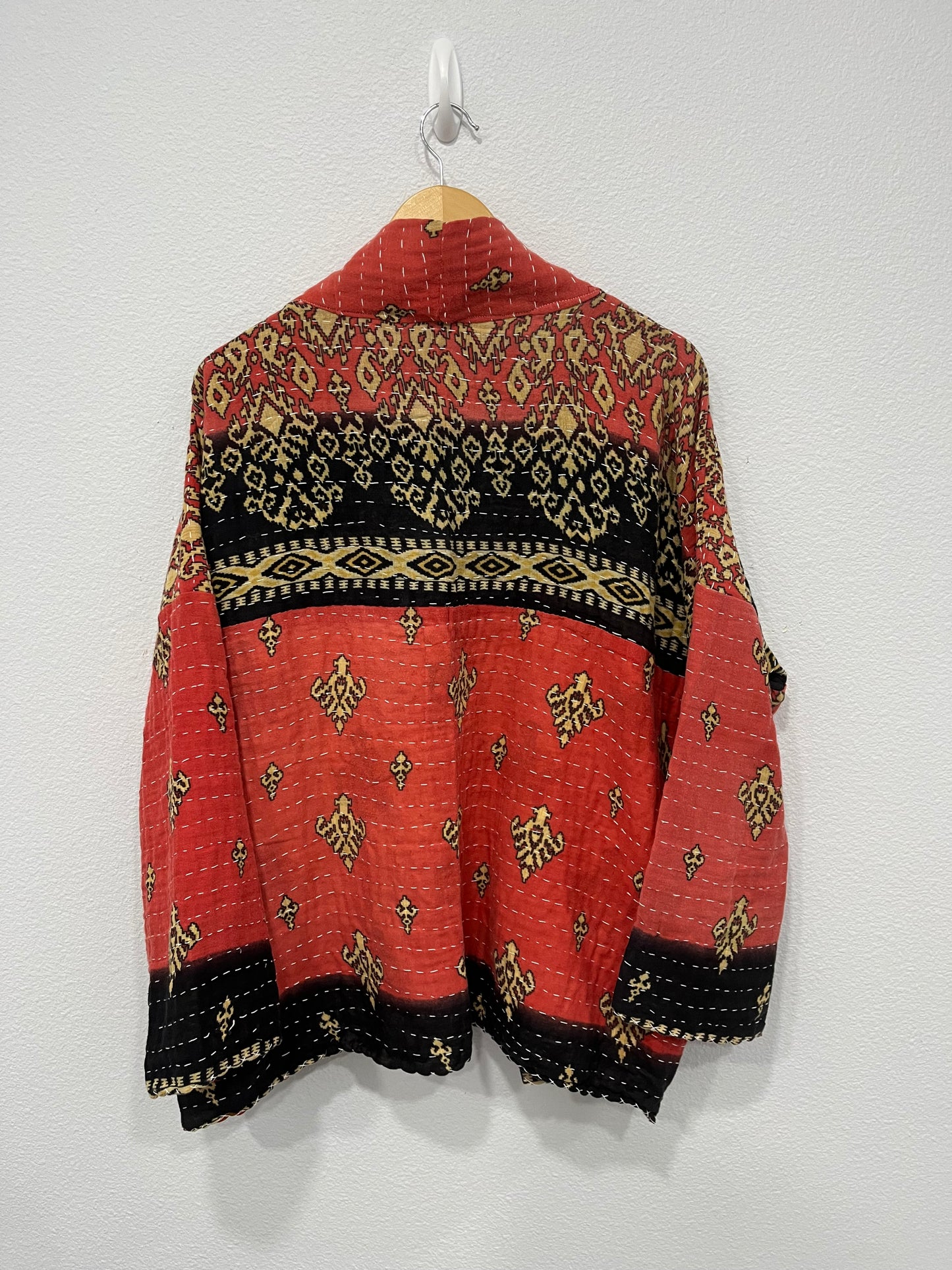 One-of-a-kind, reversible, quilted Woman's jacket. The modern patchwork makes the jacket lightweight, stylish and comfy. For confident women