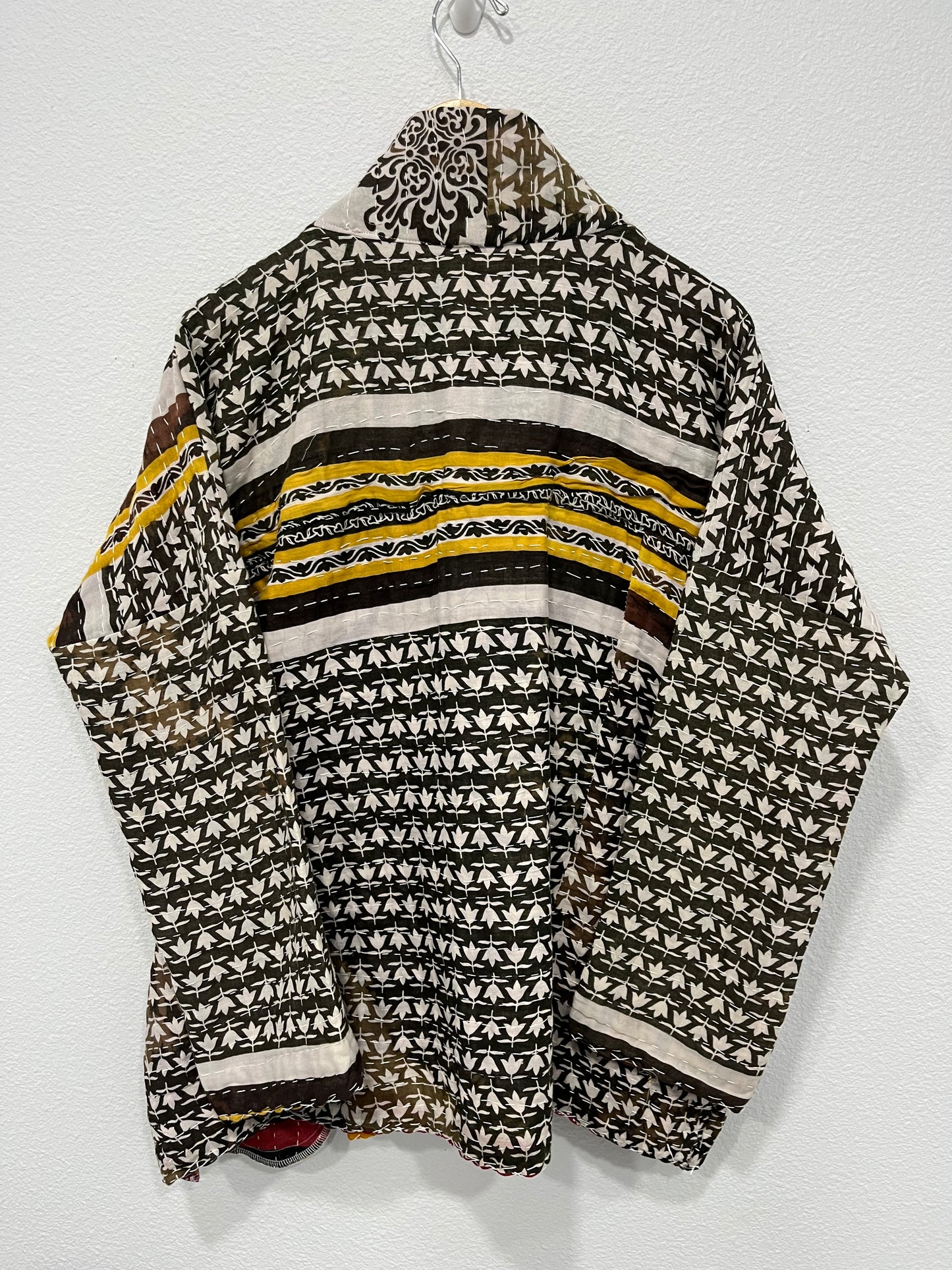 One-of-a-kind, reversible, quilted, jacket. The modern patchwork makes this coat lightweight, stylish and comfy. For confident women.