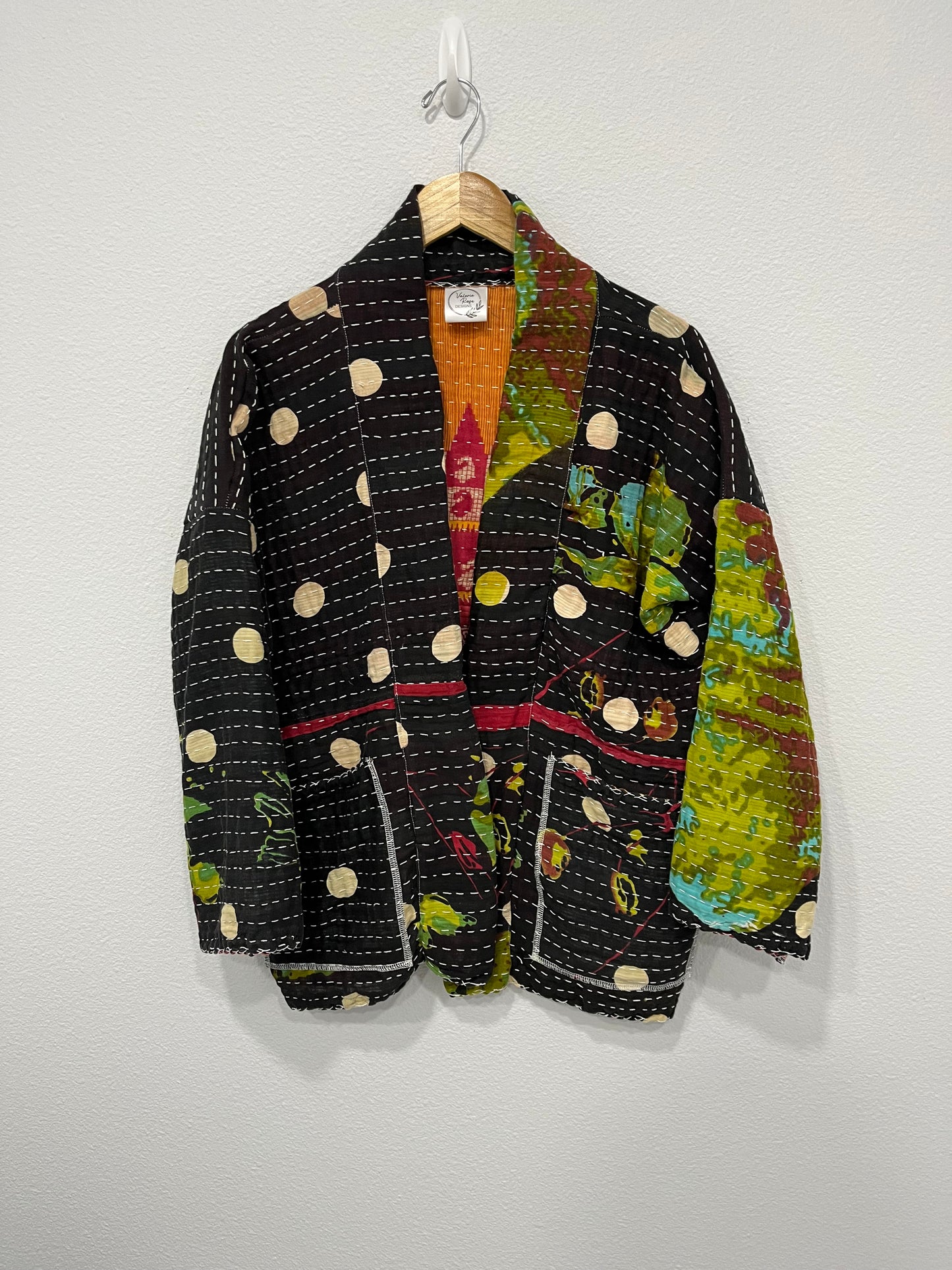 One--of-a-kind reversible, quilted Jacket. This modern patchwork makes this lightweight, stylish and comfy.t