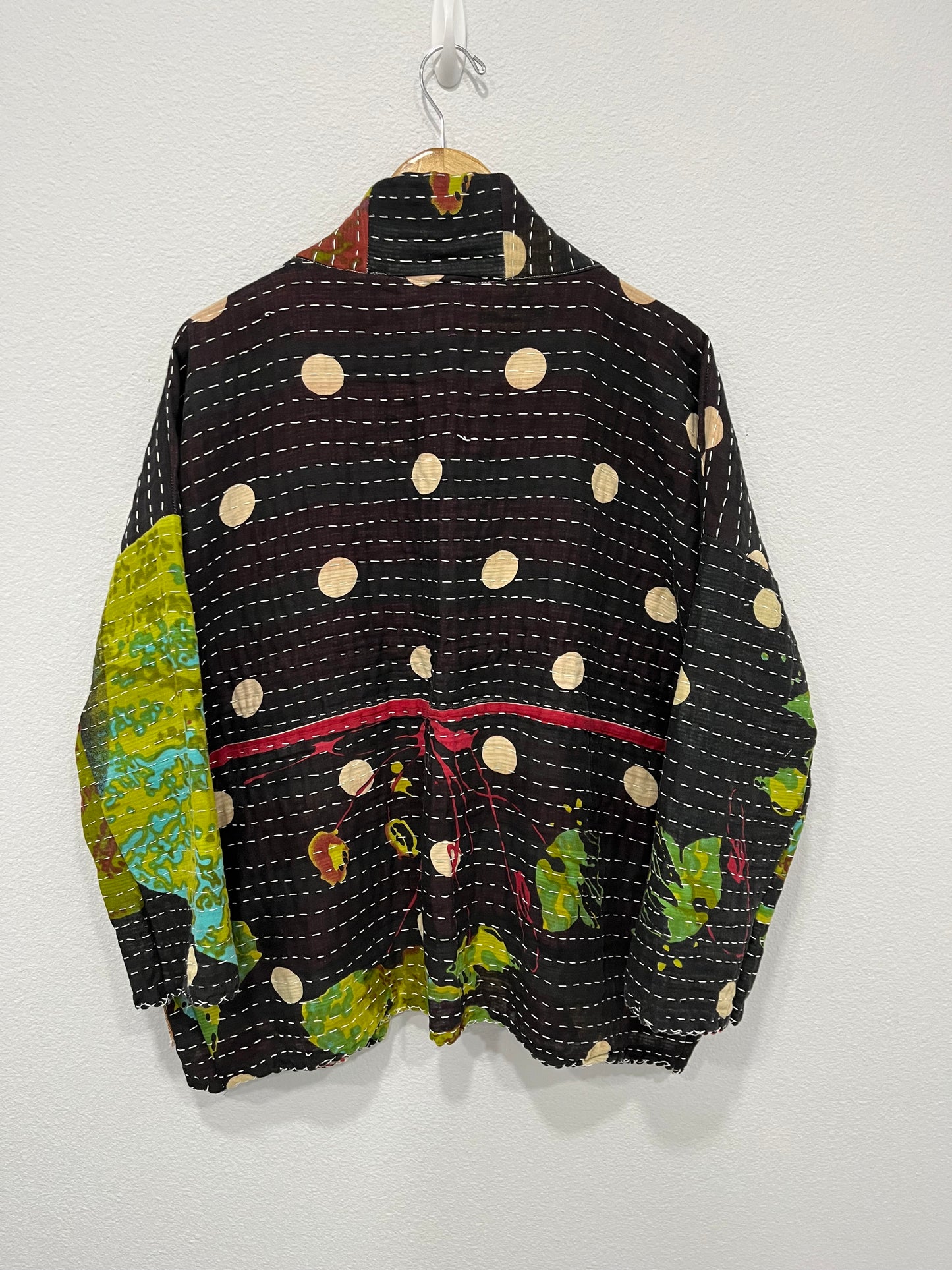 One--of-a-kind reversible, quilted Jacket. This modern patchwork makes this lightweight, stylish and comfy.t