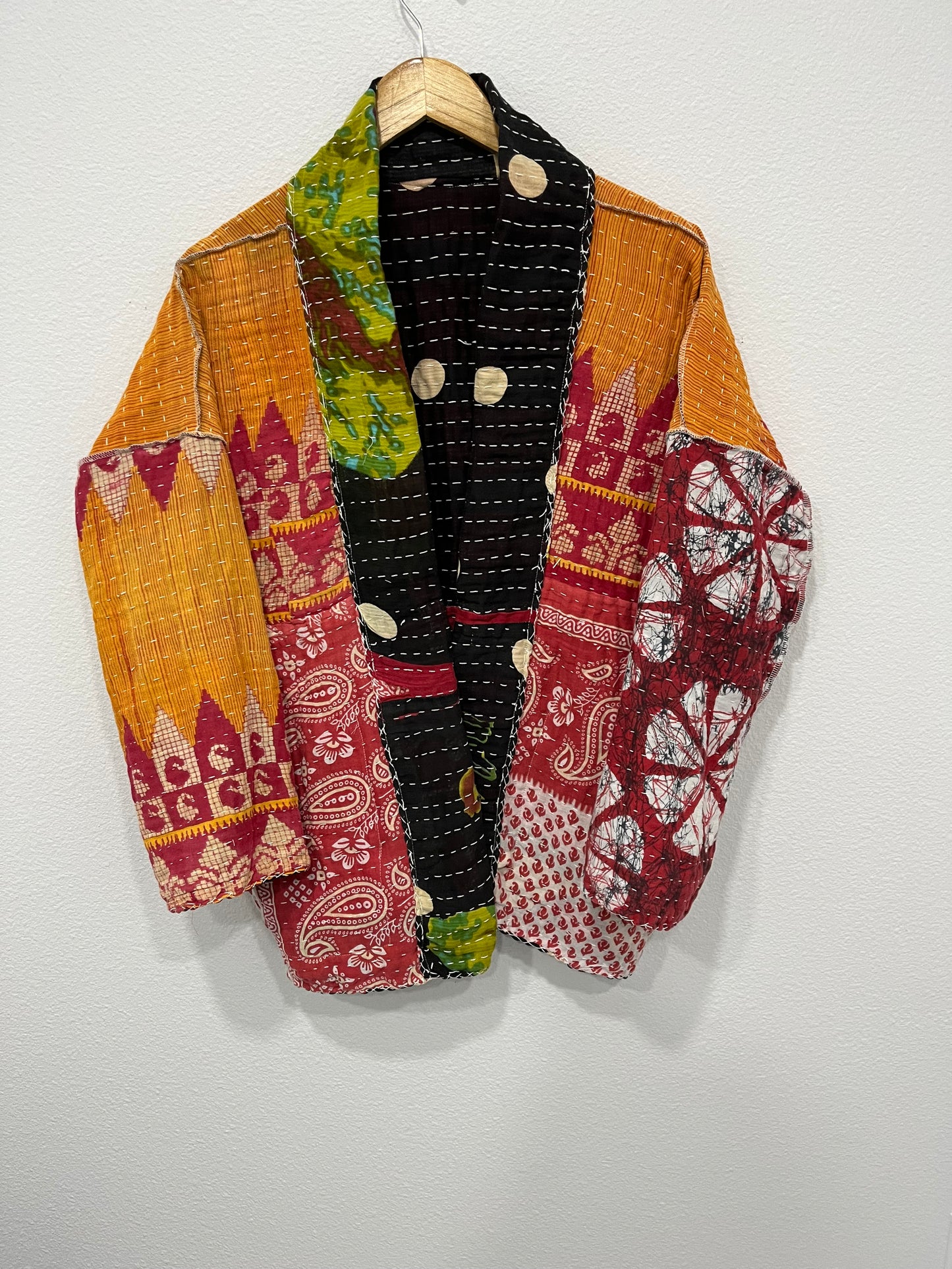 One--of-a-kind reversible, quilted Jacket. This modern patchwork makes this lightweight, stylish and comfy.t