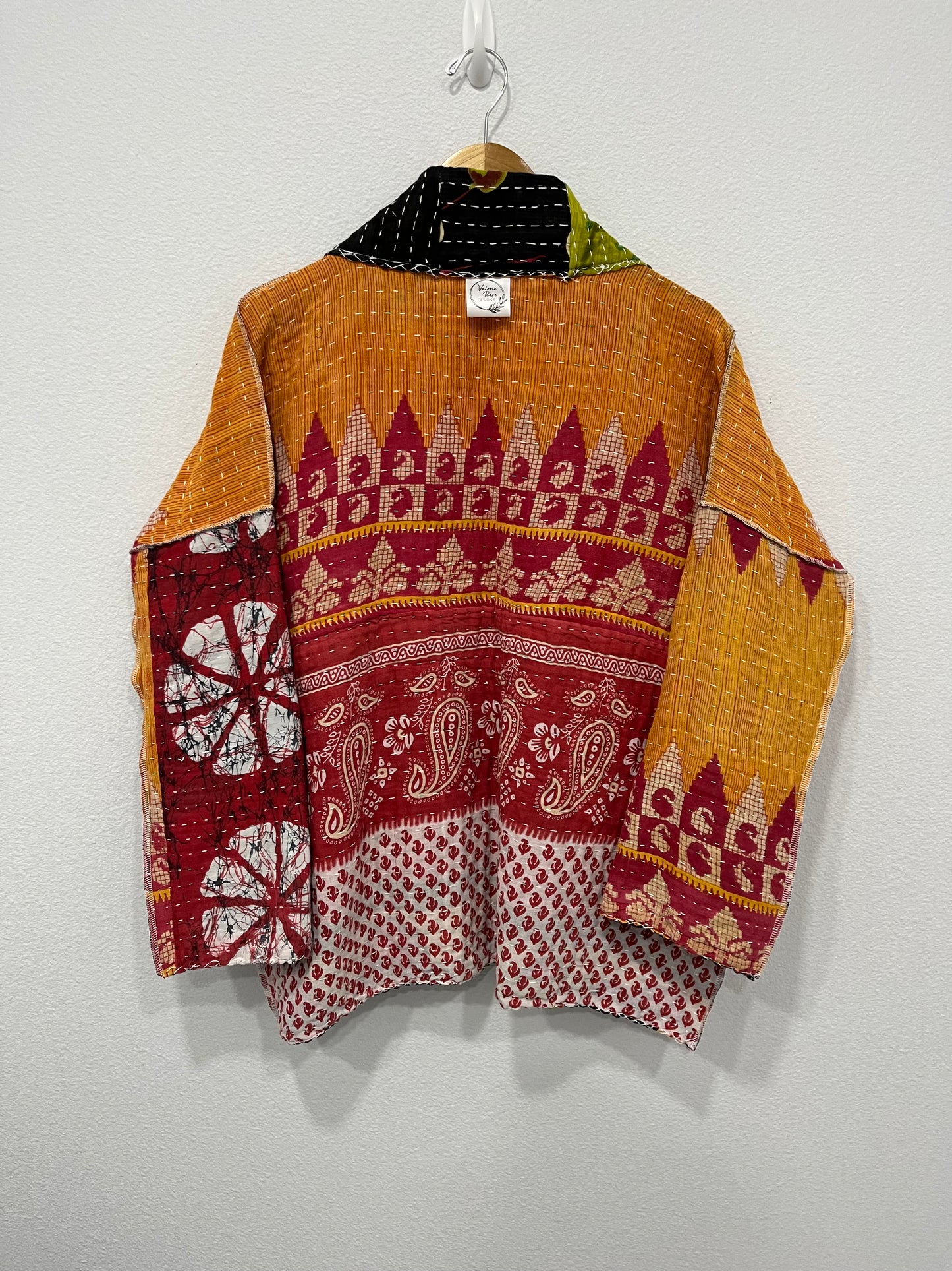 One--of-a-kind reversible, quilted Jacket. This modern patchwork makes this lightweight, stylish and comfy.t