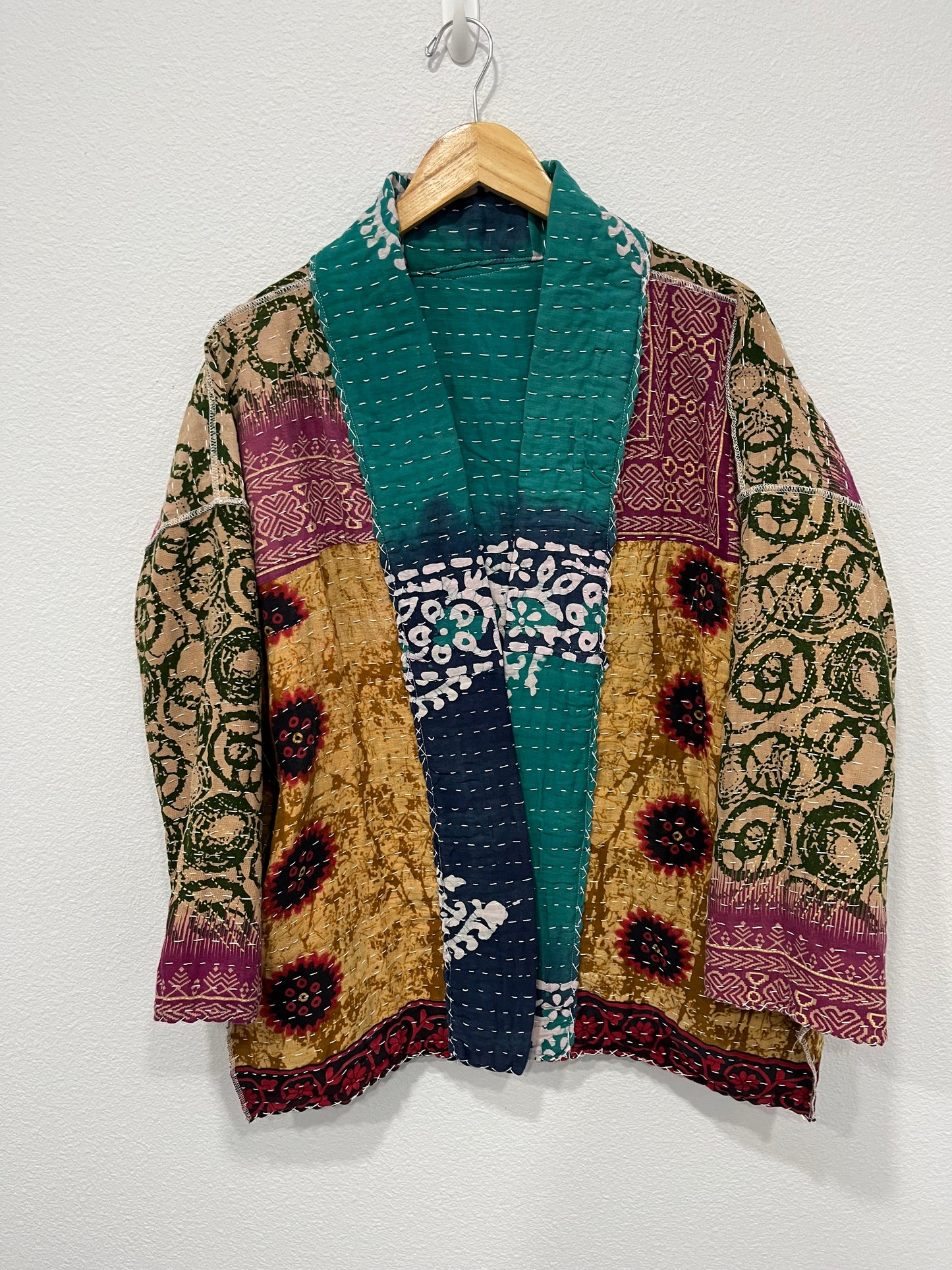 One-of-a-kind, reversible, quilted, Kantha Cloth Jacket. The modern patchwork makes this lightweight, stylish and comfy. Great for travel.