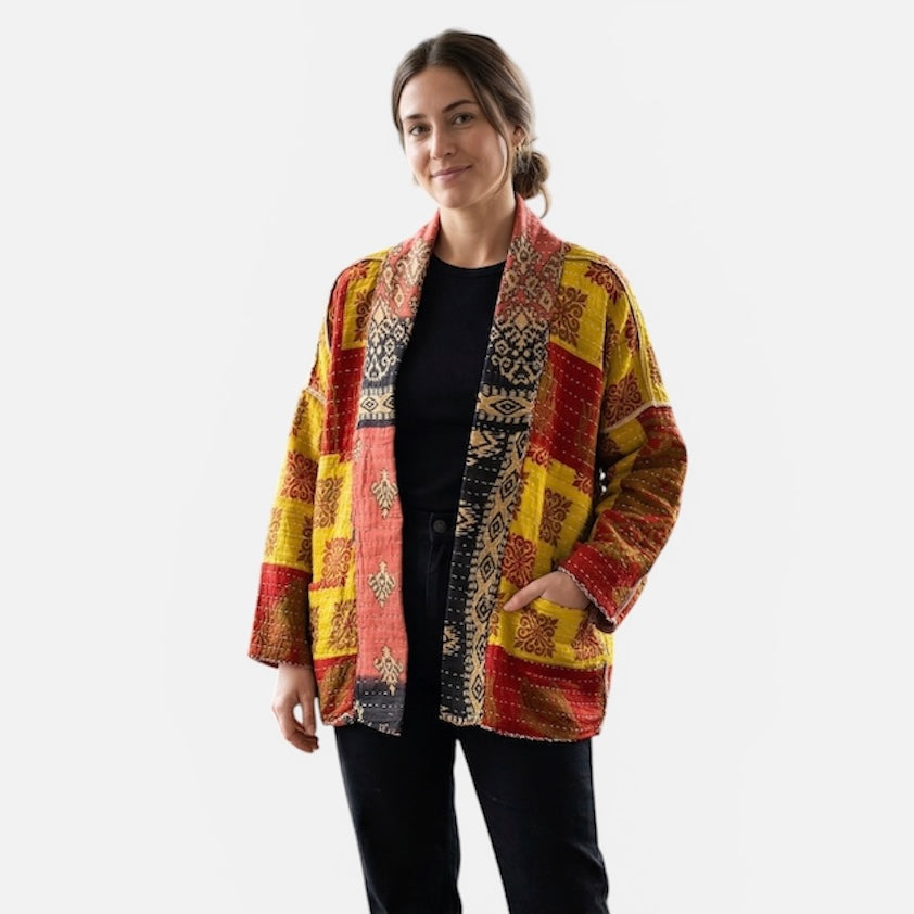One-of-a-kind, reversible, quilted Woman's jacket. The modern patchwork makes the jacket lightweight, stylish and comfy. For confident women