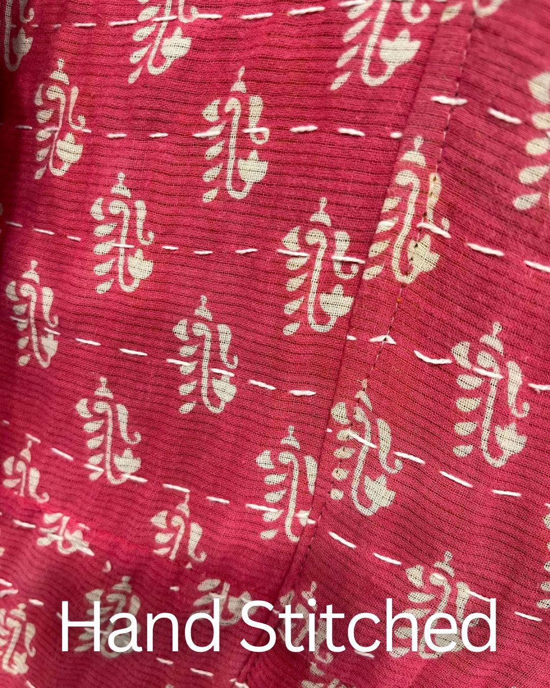 This Boho style, Pink and white patterned quilted jacket made from Kantha Cloth. This Jacket is great for traveling as it is reversable for 2 looks in 1 and light weight for easy packing.