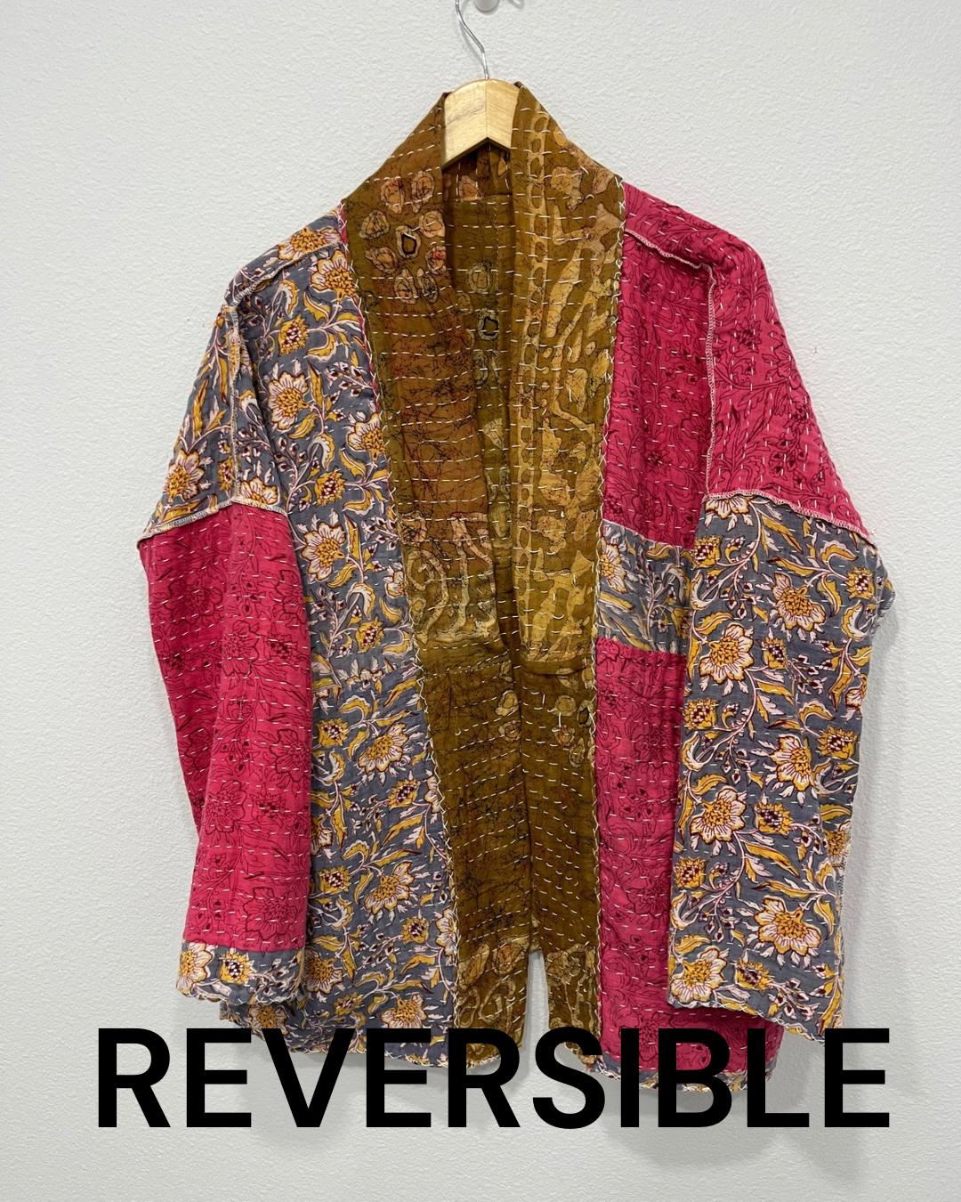 Luxury, unique, reversible quilted statement coat made for the stylish woman wanting quality over quantity. It is a light brown and beige print fabric with hot pink floral fabric inside.