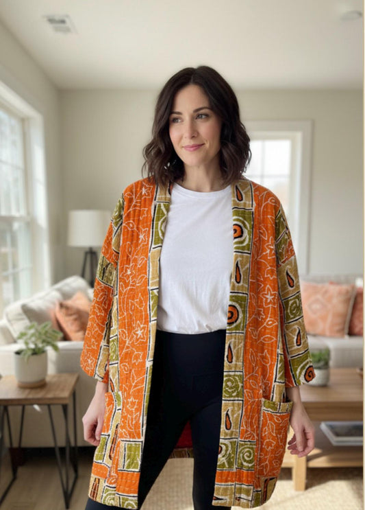 Unique, reversible Quilted Jacket made for the woman who wants a quality timeless piece. This orange, beige and olive patterned Jacket is easy for traveling with large pockets.