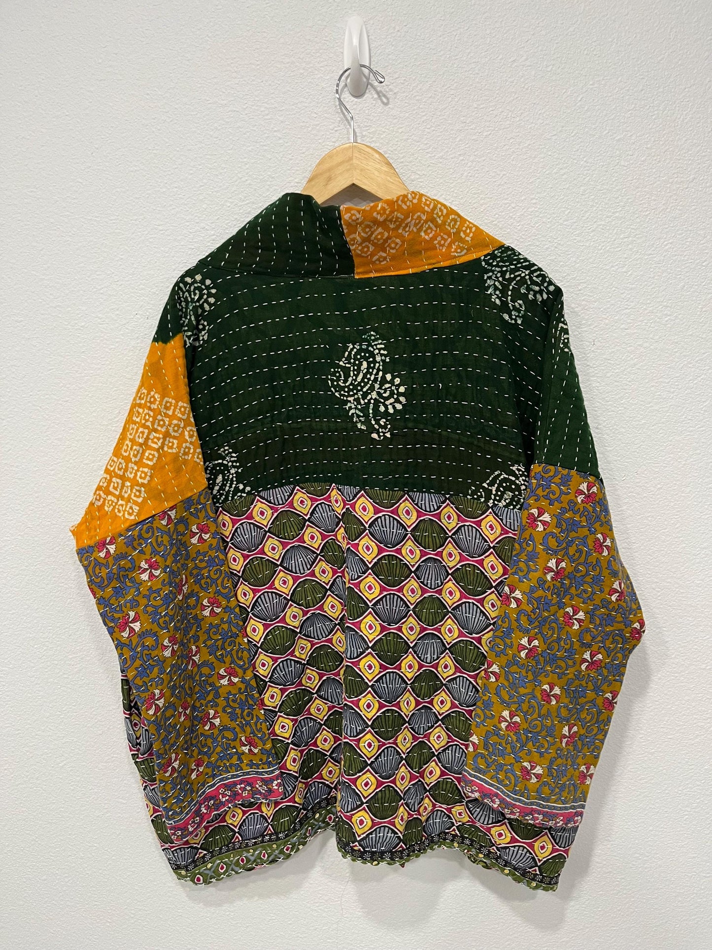 Luxury Boho Green and yellow geometric pattern and Patchwork-like quilted Jacket is made from Kantha Cloth. It is Reversible for 2 looks in one, Sustainably made and great for traveling.