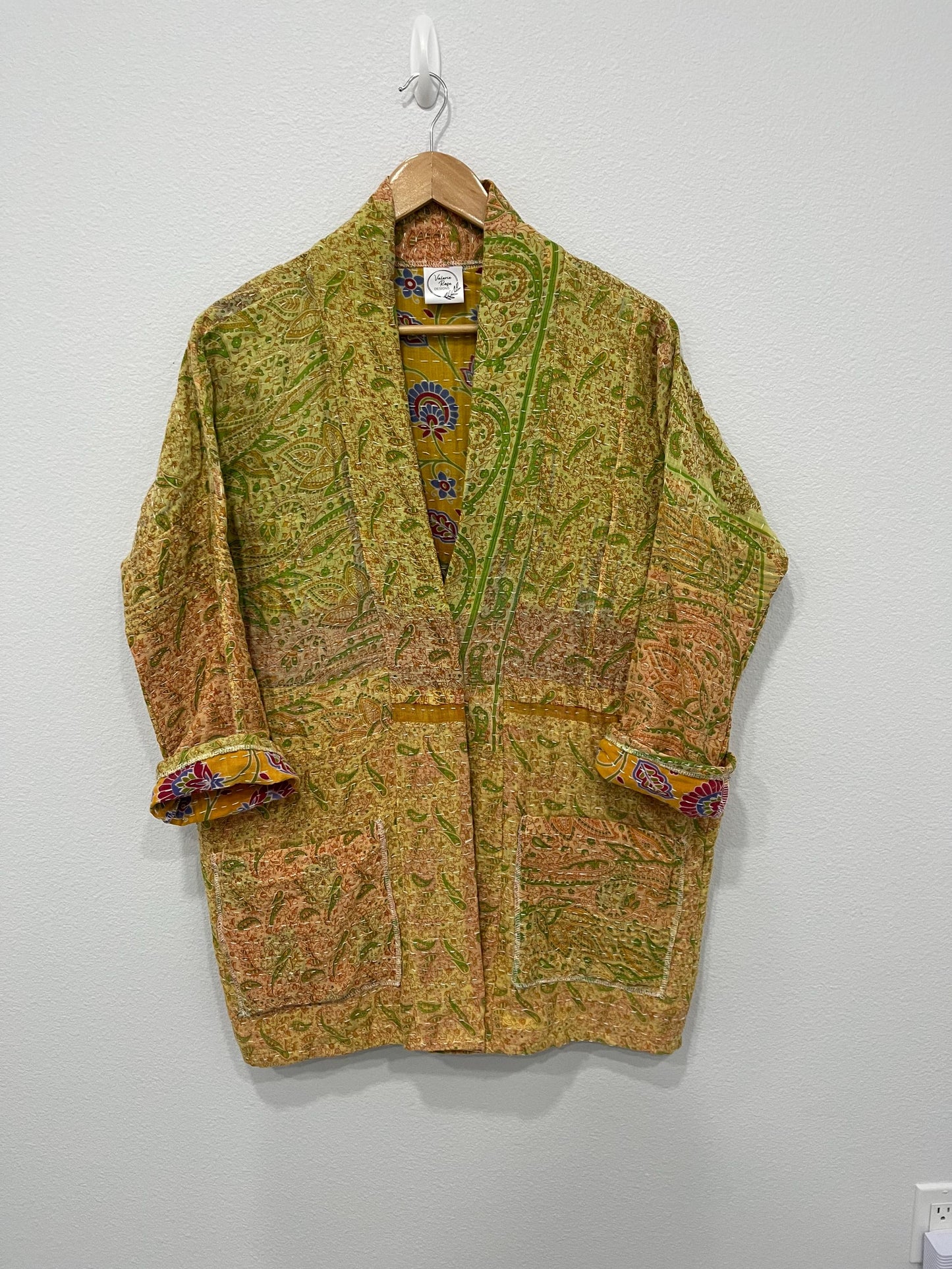 Unique Quilted statement Coat, reversible, sustainable, and made for the woman who lives life with style and grace. it is lovely with a yellow and green ombre effect with large pockets,.