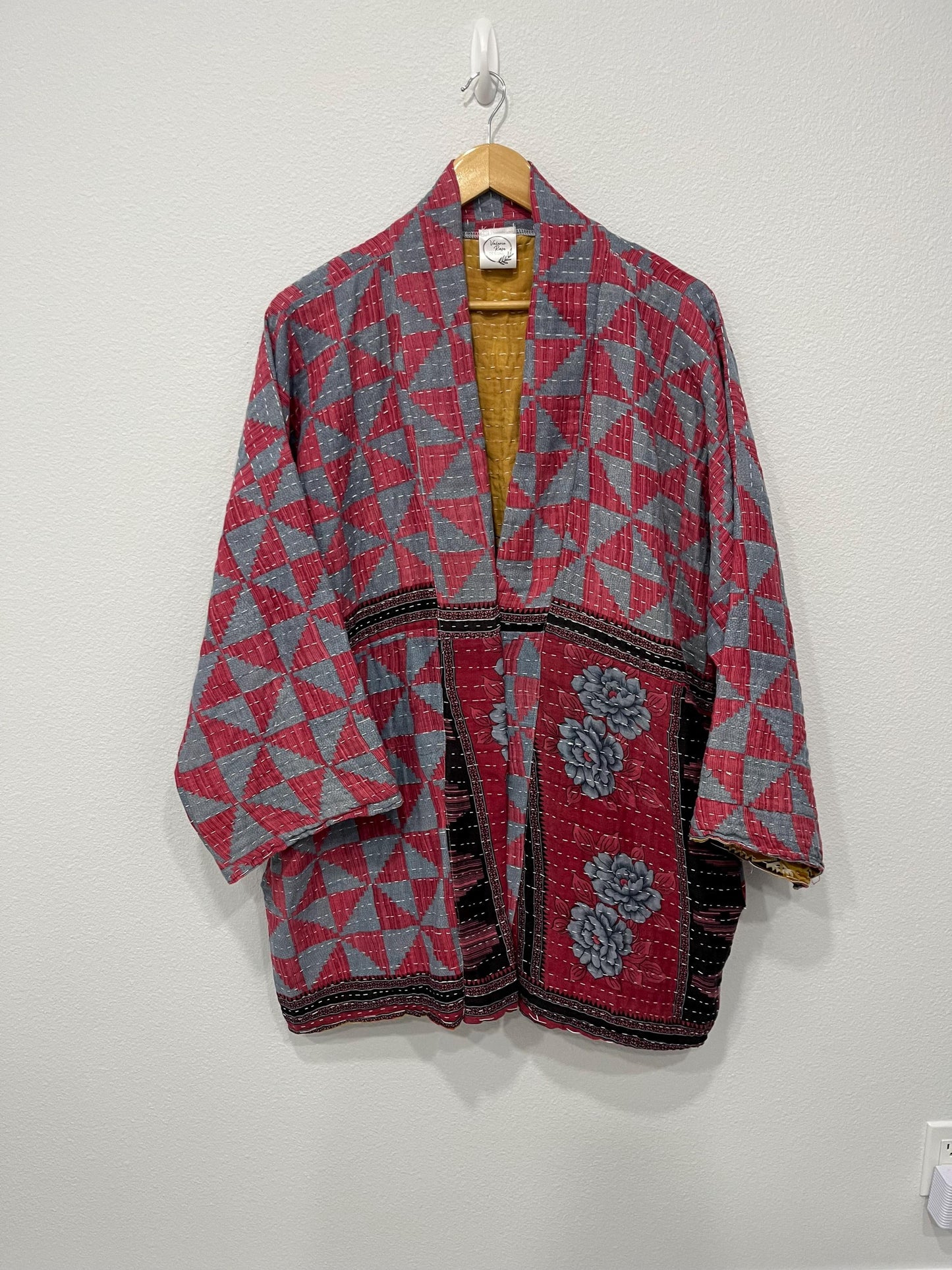 Unique, reversible, quilted, statement jacket made for easy traveling in style. This Blue and Rose-colored piece with floral border. It is comfortable and so soft..